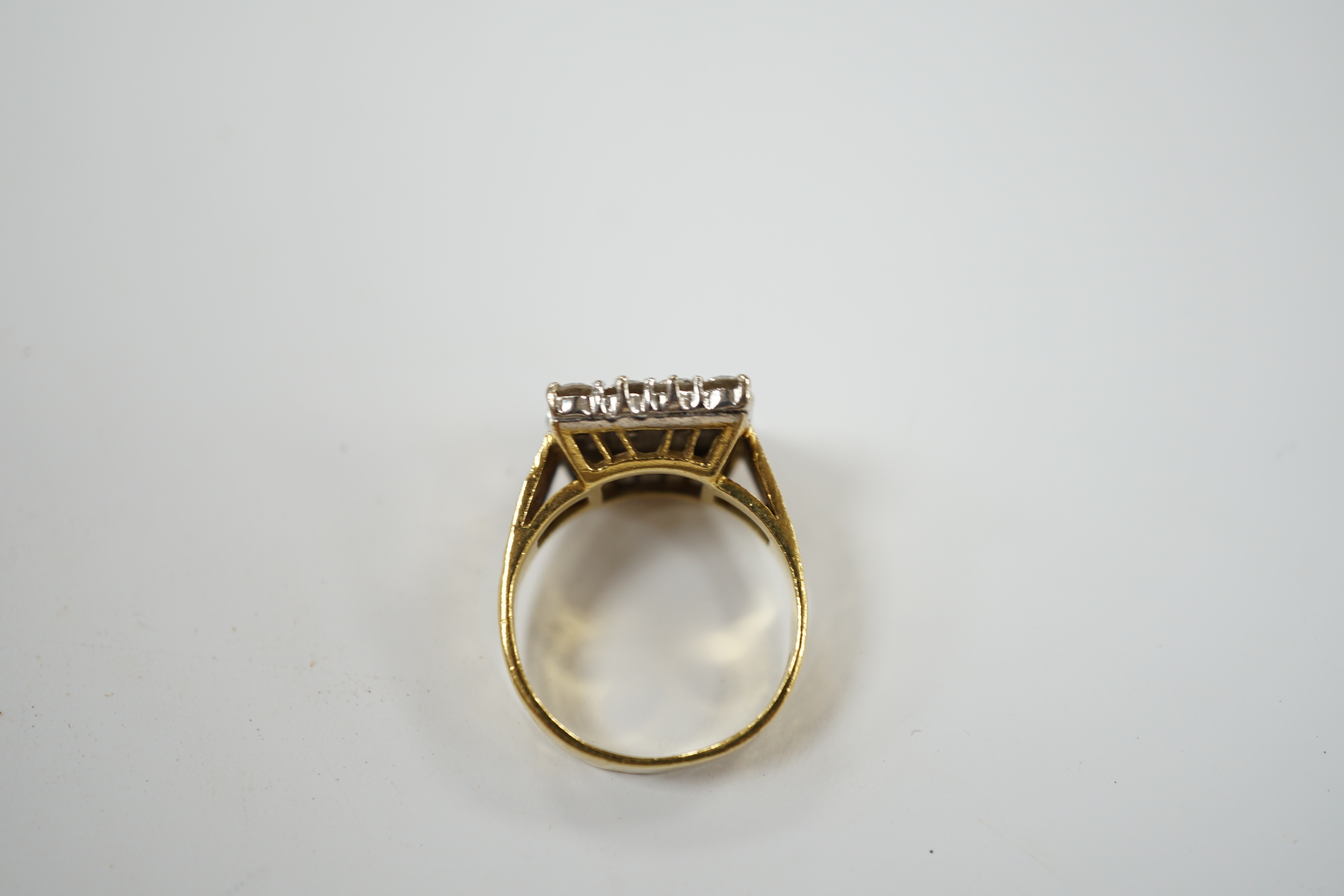A modern textured 18ct gold and diamond cluster set tablet ring, size K/L, gross weight 6.8 grams. Condition - fair
